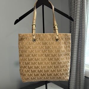 Michael Kors Gold Totes with Signature Style
